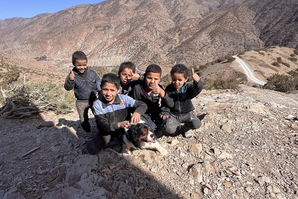 Children of a High Atlas village with a School Aid mission and the charity mascot, Barclay